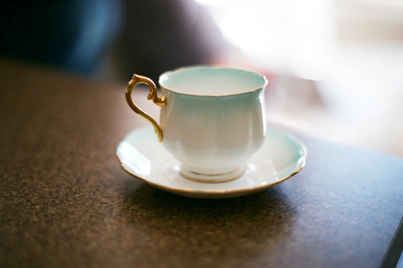 a closeup of a coffee cup with a saucer