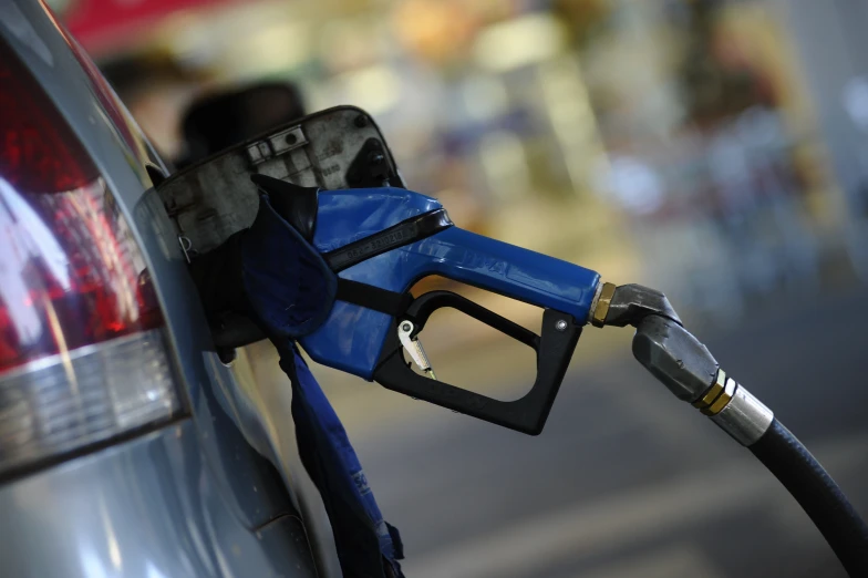 gas pumps are pictured in this image of a car's fueling hose