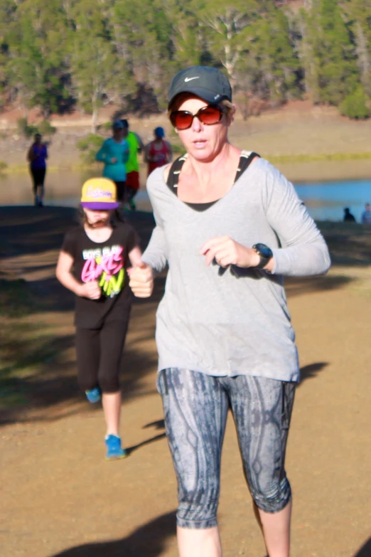 a woman running in a run with her child