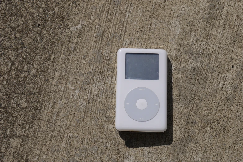 a small ipod sitting on the ground