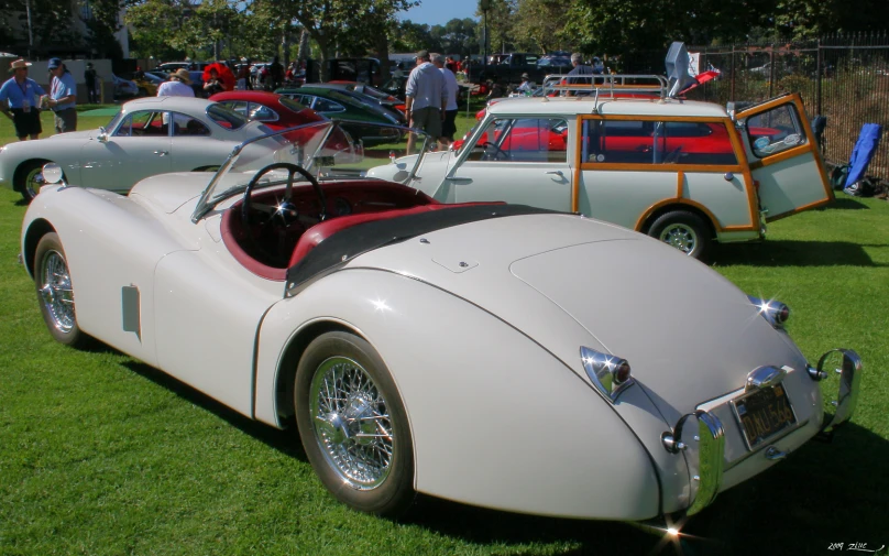 an old car that is on display at a car show