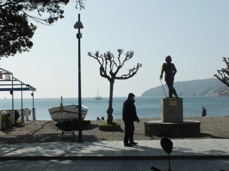 a woman that is standing near the ocean