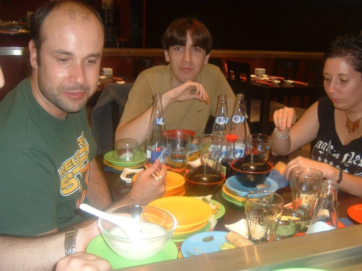 a couple of people at a table eating