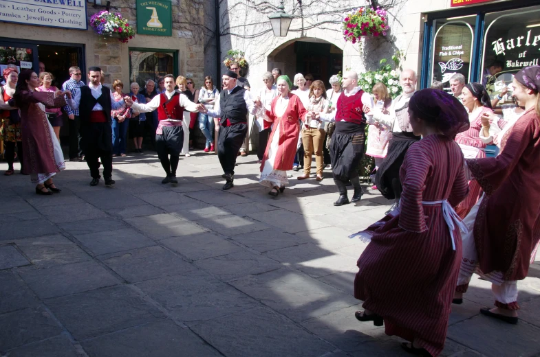 the people in the street are dancing to music