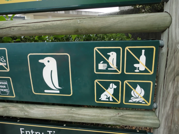 a sign about animals in a park setting