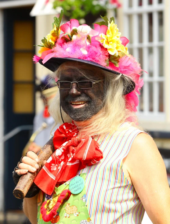 an older man with colorful hats and sunglasses