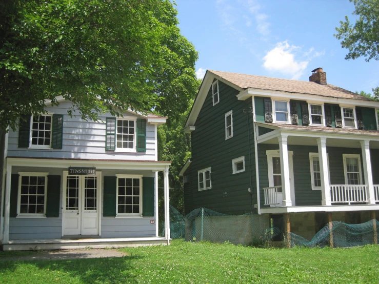 there is a large green house with many windows