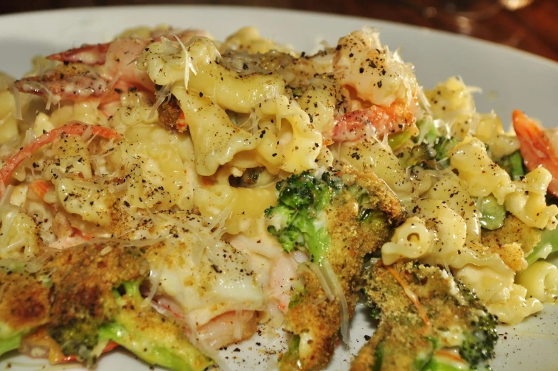 some type of pasta dish sitting on a white plate