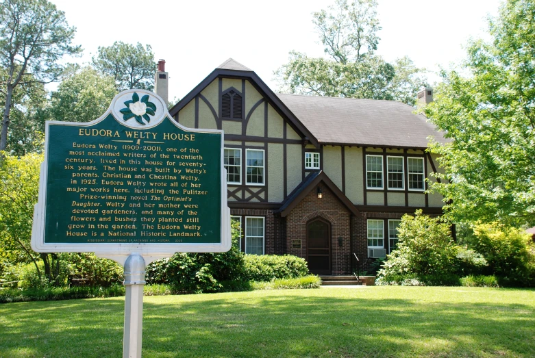 a sign is in front of a large building