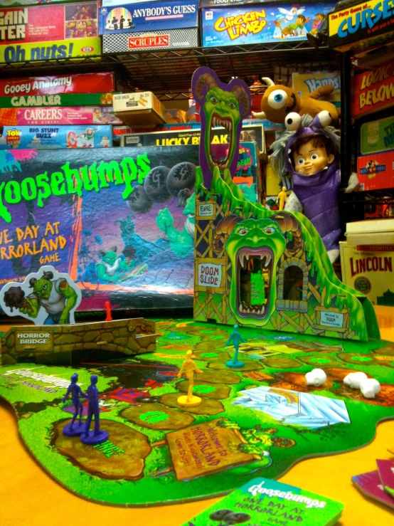 a close up of a game room with monsters on the wall