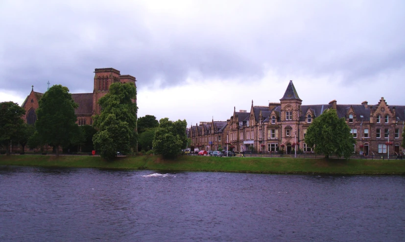 a river is in front of a large building