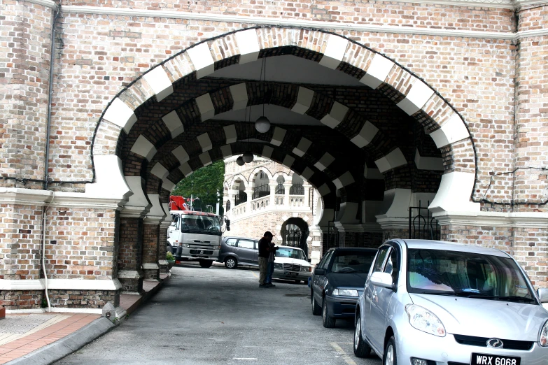 some cars are parked and a tunnel near another