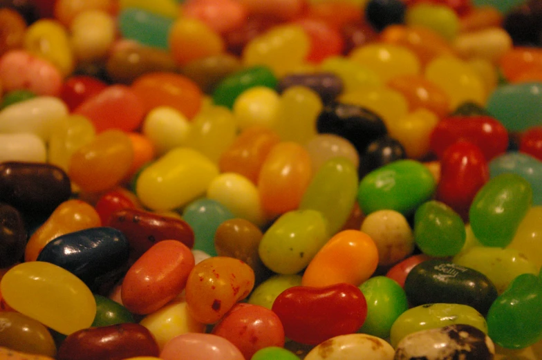 a pile of colorful candy beans are on the ground