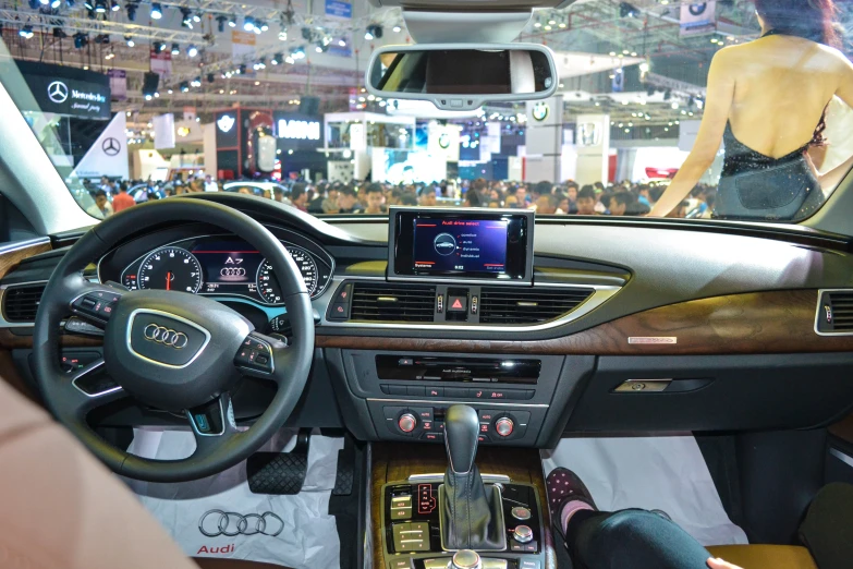 the driver's cockpit of an audi car on display at an auto show