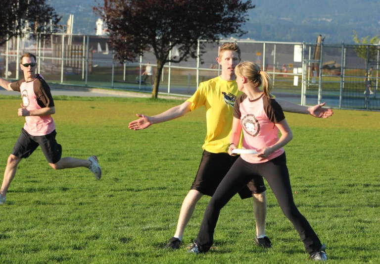 a man and two s running in the park