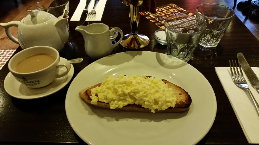 the toasted bread on the plate has eggs on it