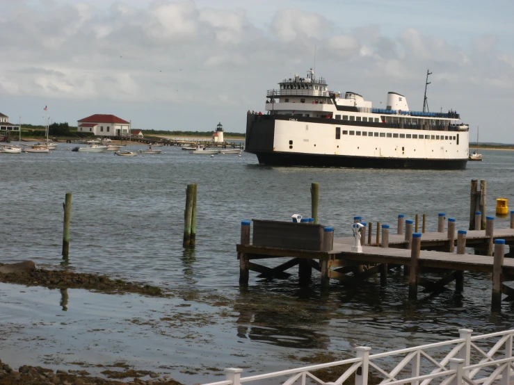 a cruise ship sailing in the water next to dock