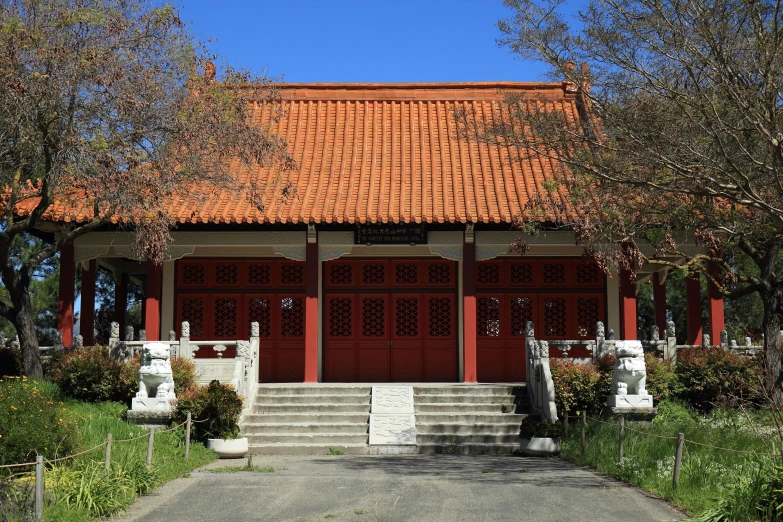 a gazebo with steps leading to it and some trees in the foreground