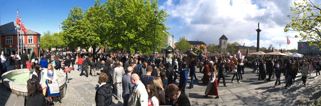 an image of a crowd of people walking down the street