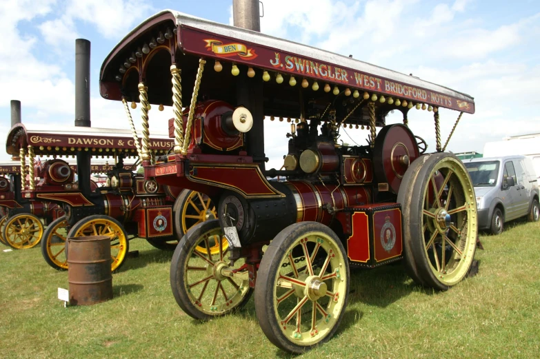 a replica of a victorian train in a field