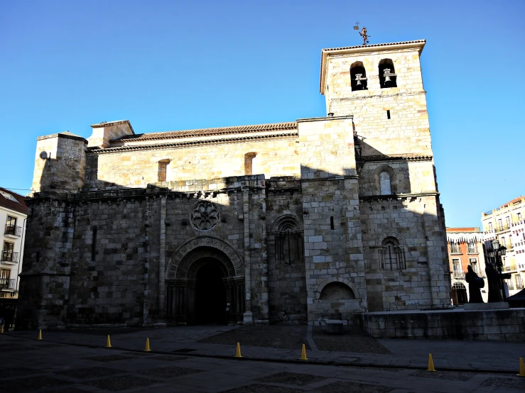 an old stone cathedral with two clock tower