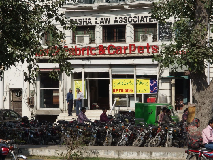 an outside view of some shops with bicycles