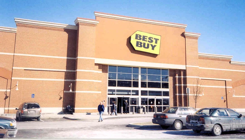 two cars parked in front of the store