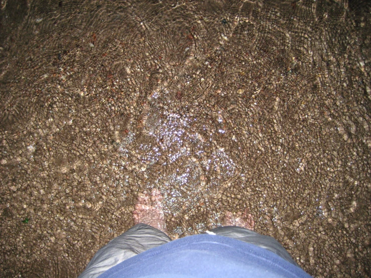 a man who is standing on some sand