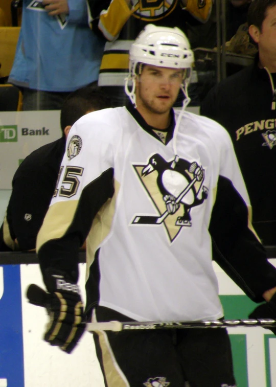 a male ice hockey player in a uniform