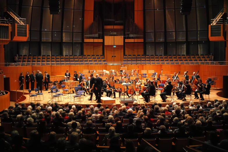 the conductor is surrounded by band on stage