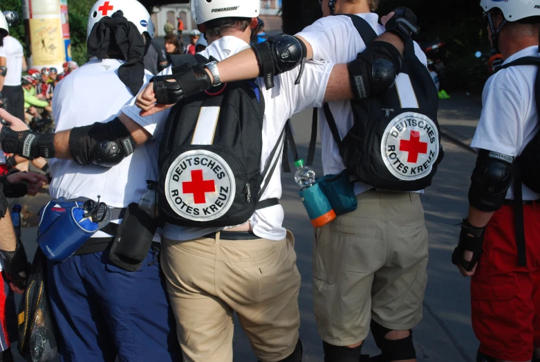 a bunch of people with backpacks standing around