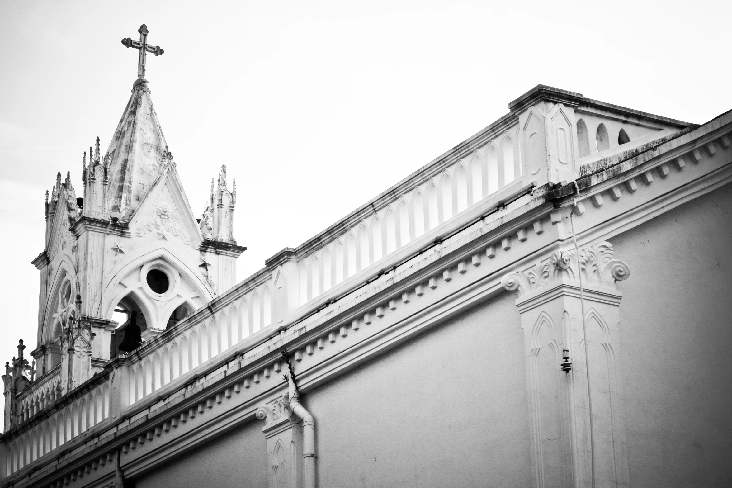 a cross is atop the steeple of a building