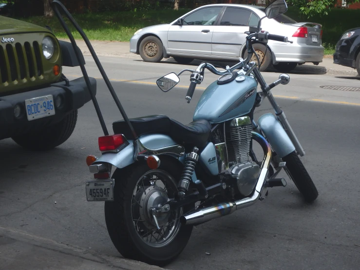 there is a blue motorcycle with a bike attached to it