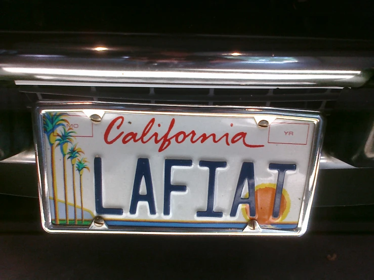 a license plate on the bumper of a car that says california