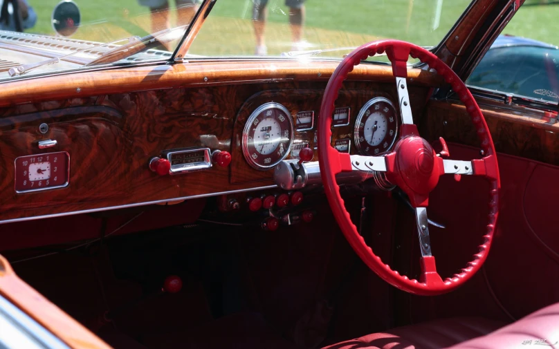 an interior view of a wooden car with the dashboard showing