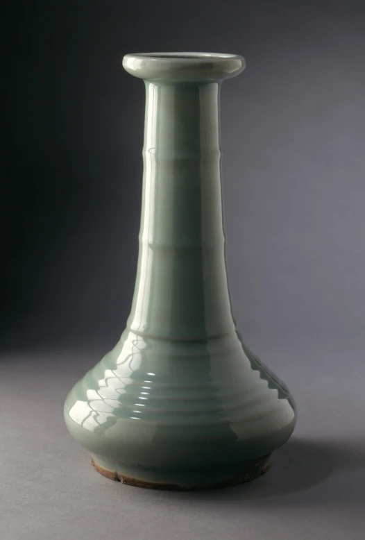 a tall vase that is green in color