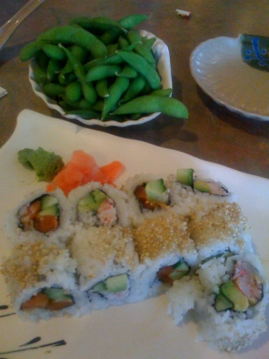 several plates of food including vegetables and rice