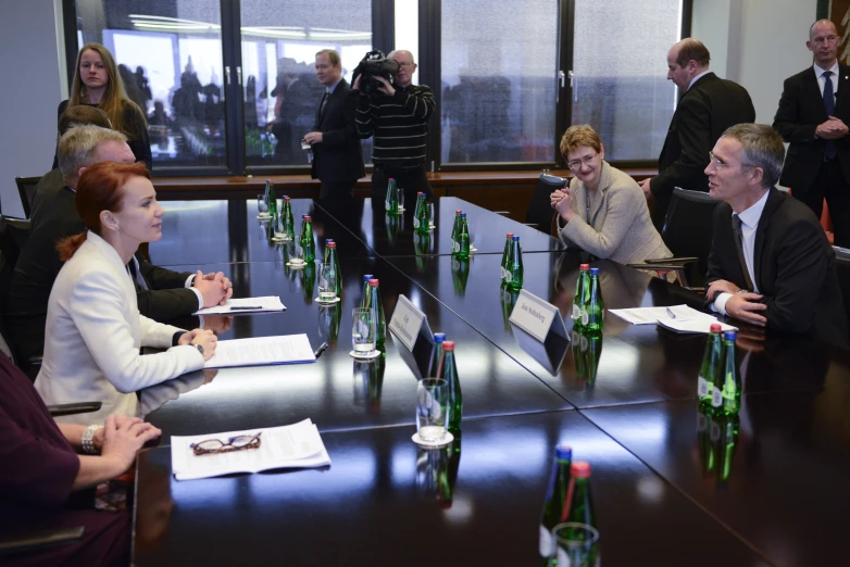 people sitting at a conference table during a discussion