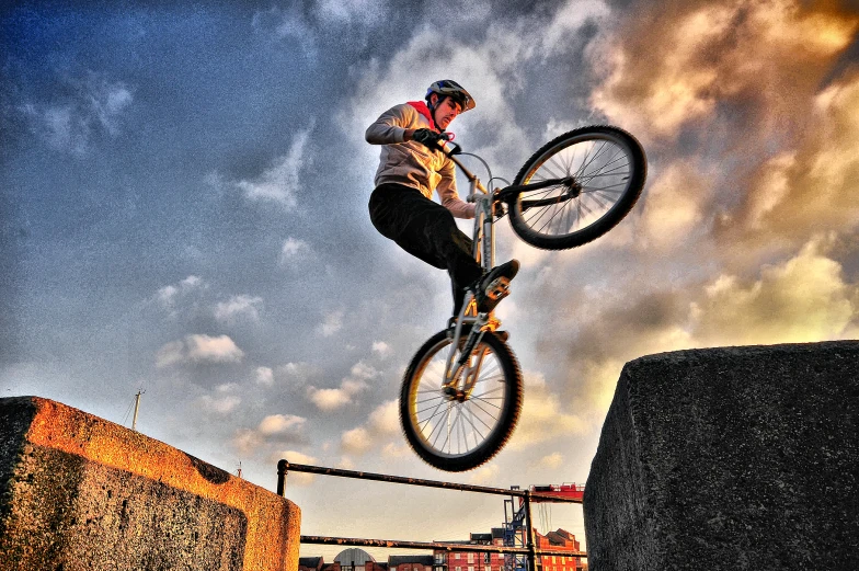 an image of a man on his bike doing a trick