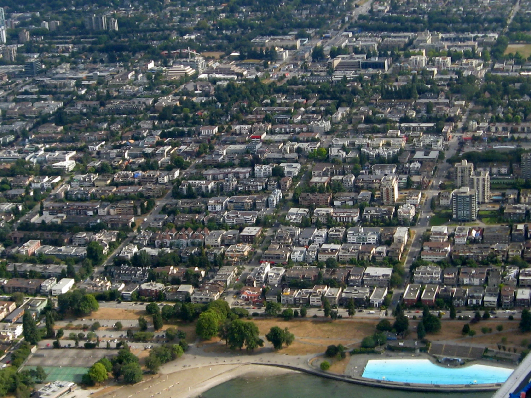 a city and beach from an airplane