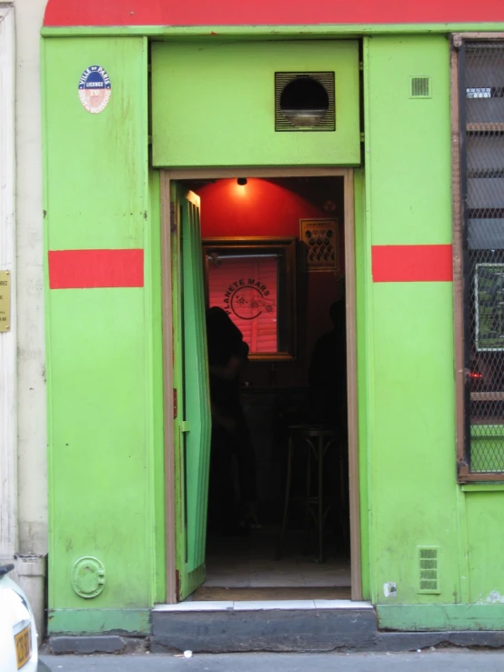 the entrance of the building has an open door to another room