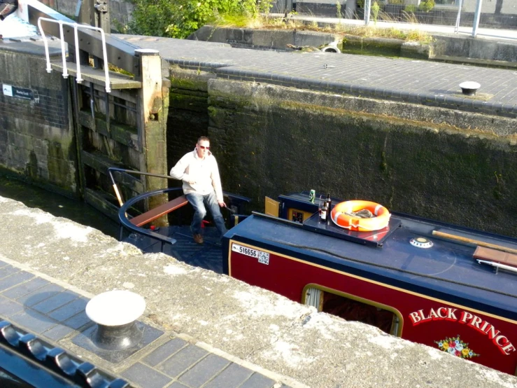 a boat parked on the side of a river