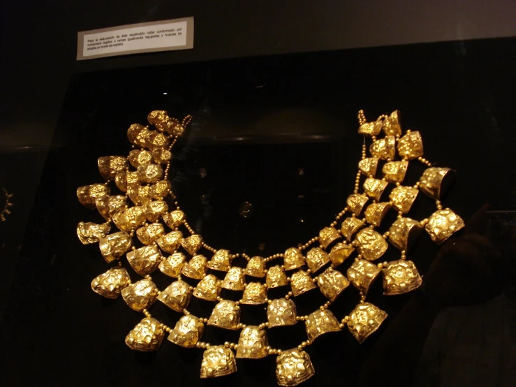 a very beautiful and fancy gold necklace