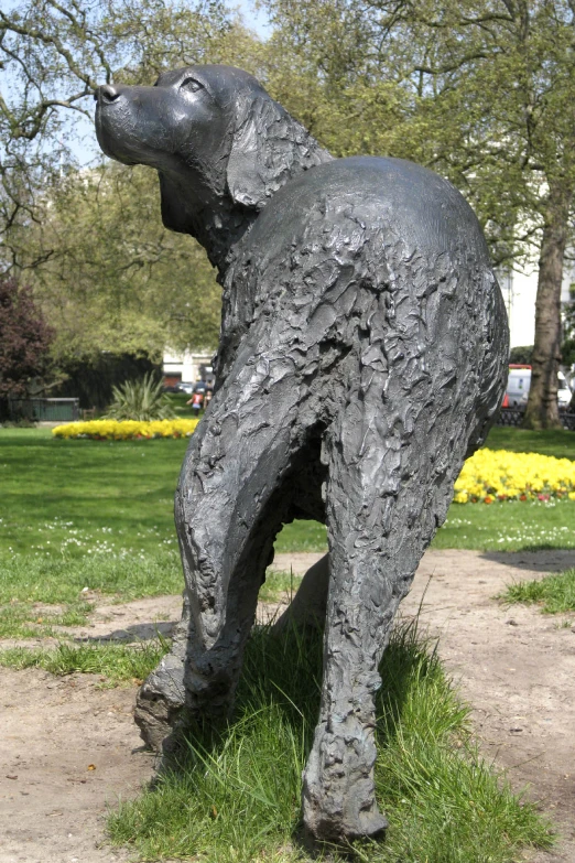 this statue has a dog in its paws