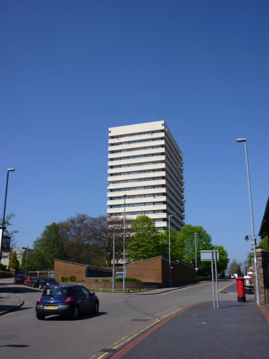 a very tall building next to a street