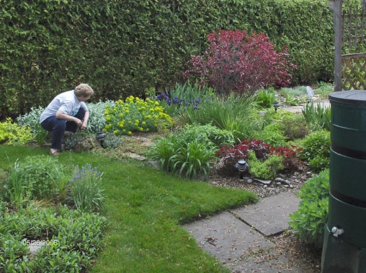 the little boy is working in his garden
