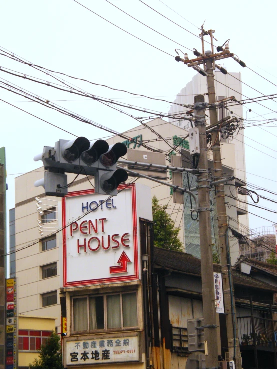 a red sign that is on top of a pole