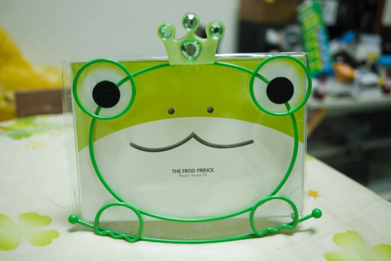 an adorable green frog made of clear plastic