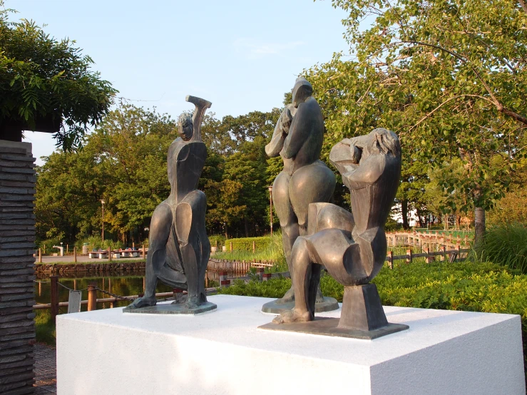 two statues of different types on a stone slab