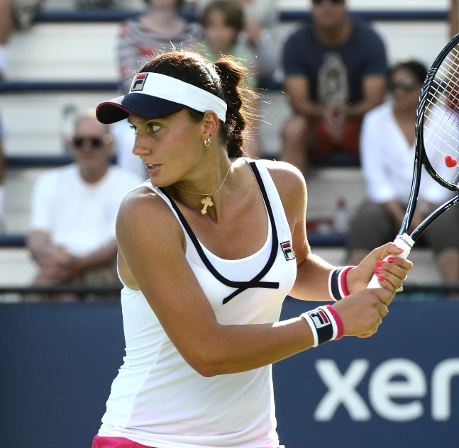 a tennis player waits for the ball during a match